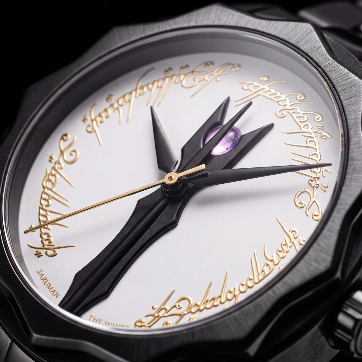 Close-up of the Saruman dial at an angle, the amethyst between the staff points and gold Elvish script around the rim